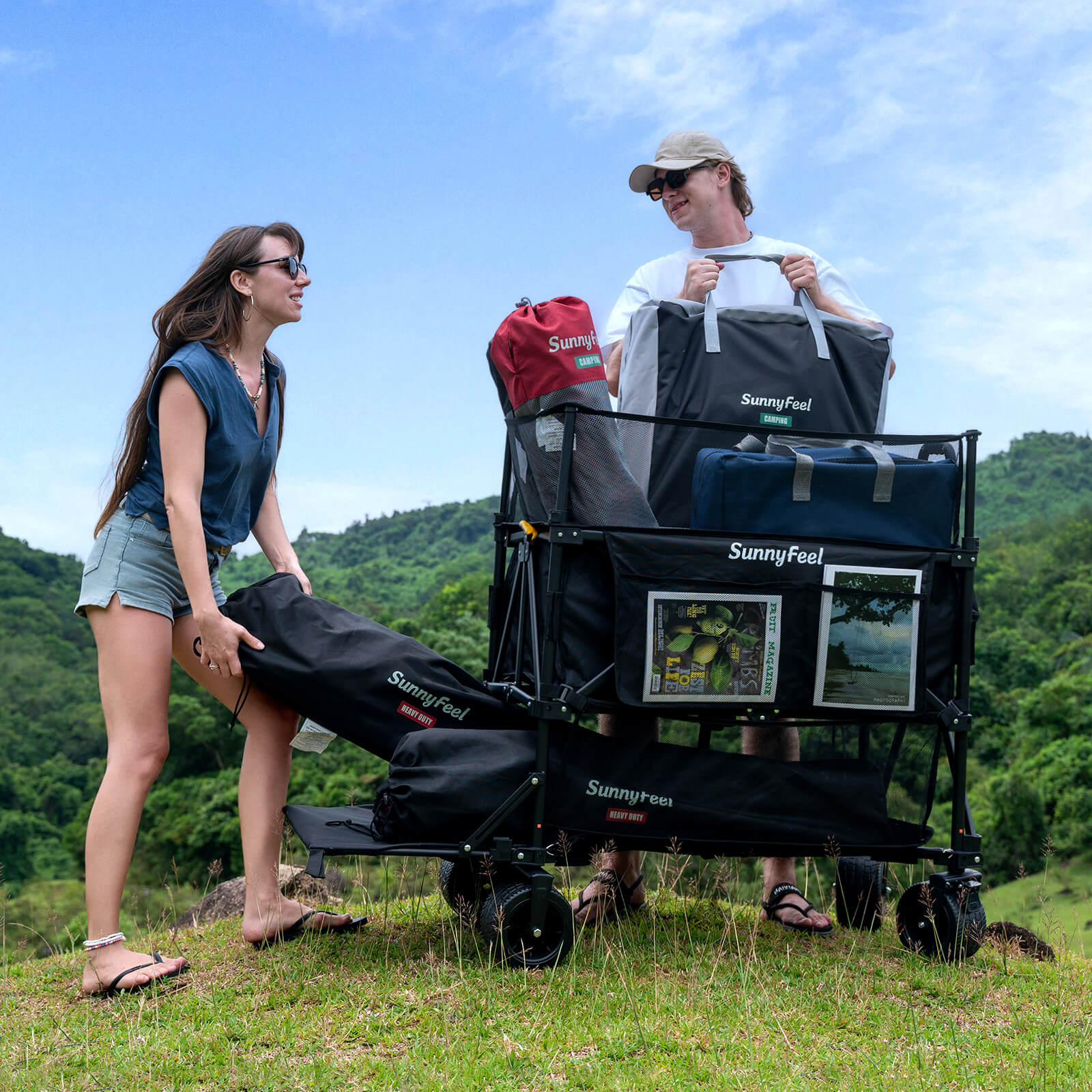 Two people with a Sunnyfeel folding cart in a scenic outdoor setting