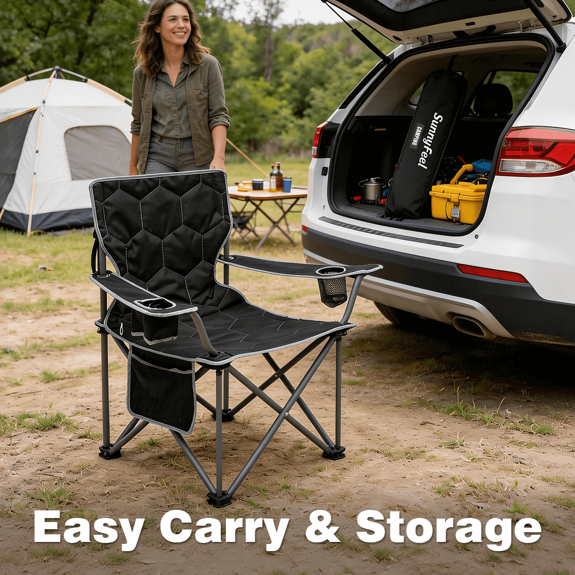 Black camping chair in front of an open car trunk with camping gear, including a tent and supplies.