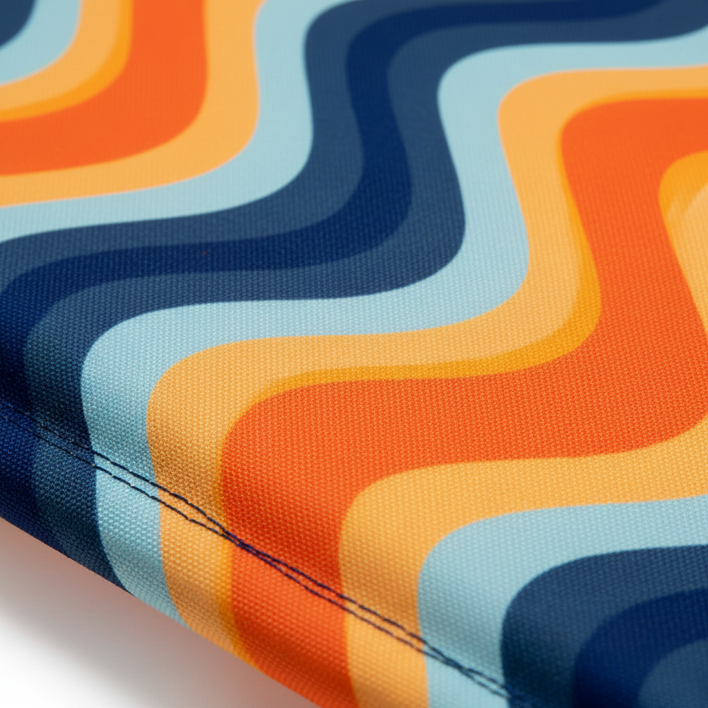 Close-up of fabric with colorful wavy pattern in orange, blue, and yellow.