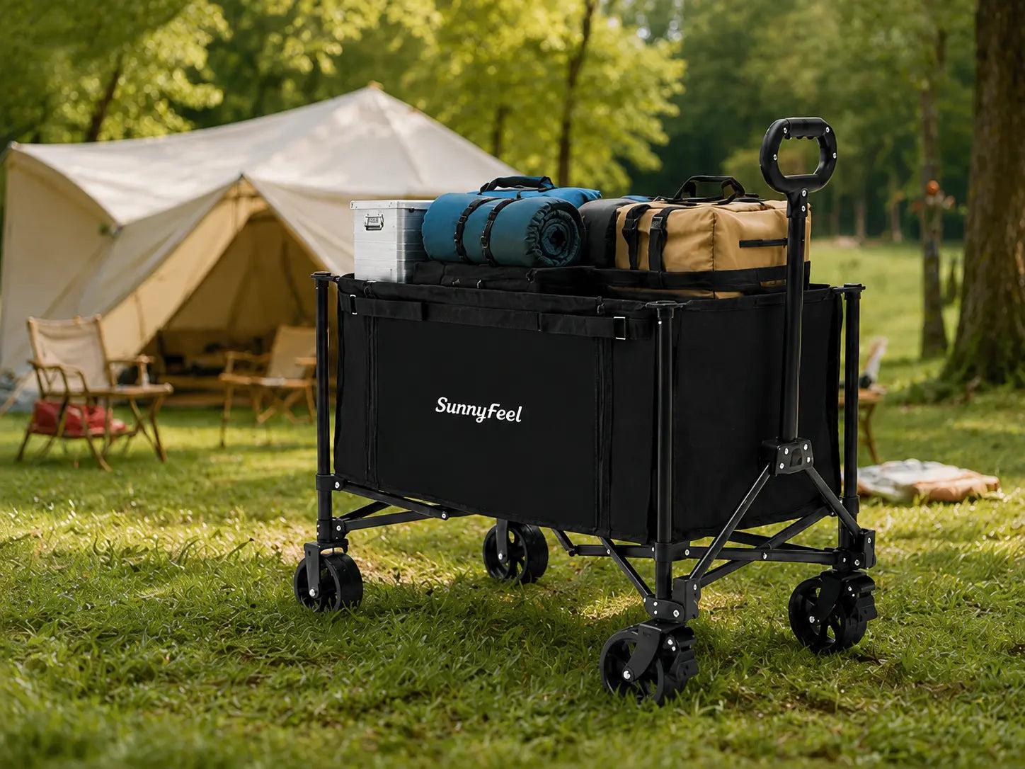 Black camping cart with supplies in a grassy area with tents in the background