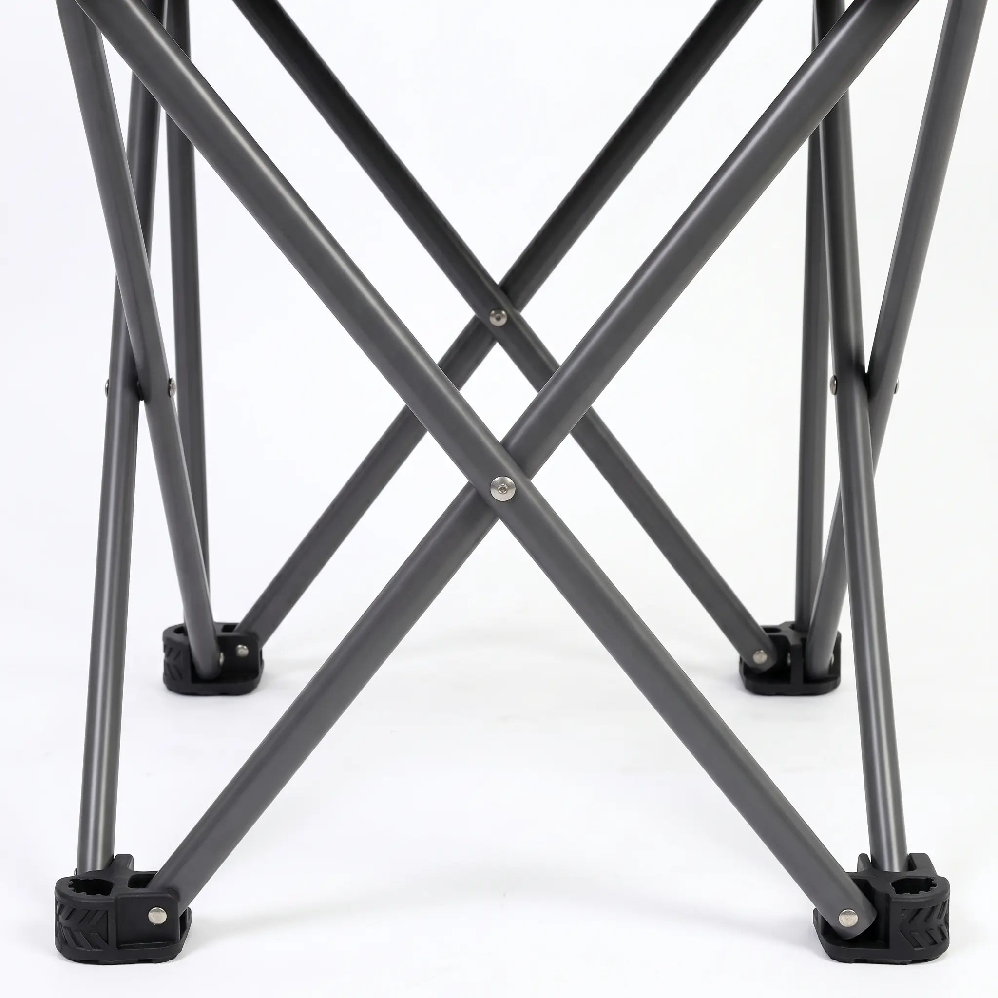 Close-up of a metal folding stool with X-shaped legs on a white background