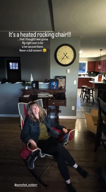Person sitting in a heated rocking chair in a home setting with text overlay.