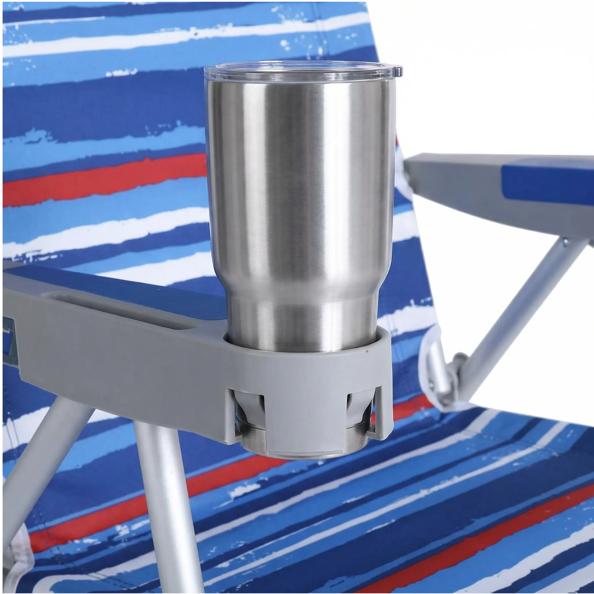 Metal tumbler holder attached to a beach chair with a colorful striped background