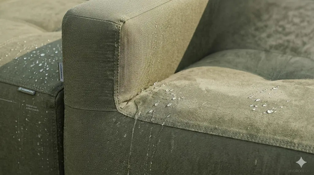 Close-up of a gray sofa with visible wear and dirt.