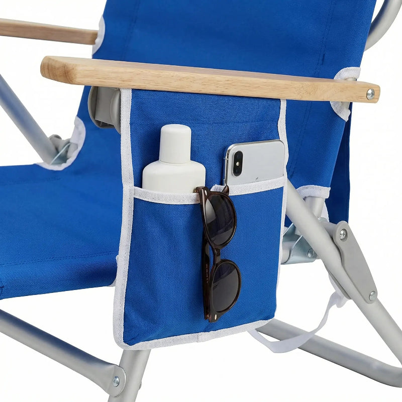 Blue folding chair with a pocket holding sunglasses and a bottle.
