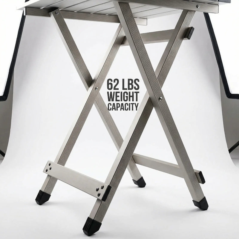 Metal folding table with weight capacity label on a white background